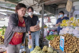 芹苴市推出首个非现金支付农贸市场