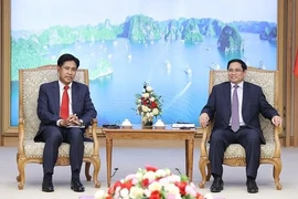 政府总理范明政会见老挝司法部部长帕维·西布阿利法