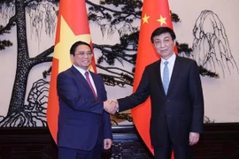 越南政府总理范明政会见中共中央政治局常委、全国政协主席王沪宁