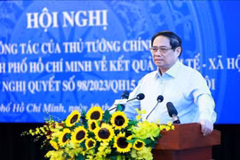 范明政在会上发言。图自越通社