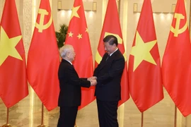 越共中央总书记阮富仲与中共中央总书记习近平举行会谈