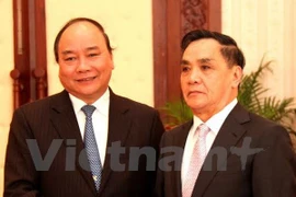 越南政府副总理阮春福与老挝政府总理通辛·坦马冯