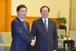 外交部长范平明会见中共中央政治局常委、中央政法委书记周永康