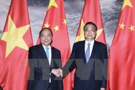 阮春福总理与中国国务院总理举行会谈。（图片来源：越通社）