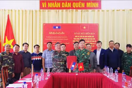 双方交换会谈纪要。图自越通社