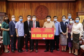 老挝卫生部部长： 不管遇到任何困难越南都与老挝人民共同分担困难