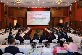 “发挥妇女在减少自然灾害风险，应对气候变化”论坛场景。（图片来源：越通社）