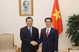 越南政府副总理武德儋会见中国文化部部长雒树刚。（图片来源：越通社）