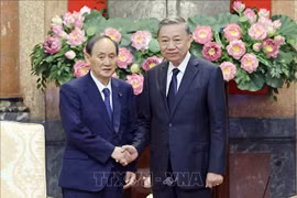 越南国家主席苏林会见日本首相特使、前首相菅义伟。图自越通社