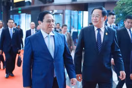 越南政府总理范明政会见老挝总理宋赛·西潘敦。图自越通社