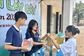 宣传青少年“以书换树”的美好行动。图自越通社