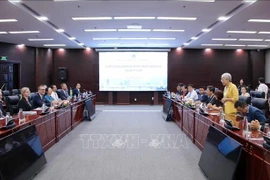 会见场景。图自越通社