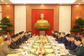 越南共产党代表团与老挝人民革命党代表团会面场景。图自越通社