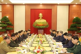 越南共产党代表团与老挝人民革命党代表团会面场景。图自越通社