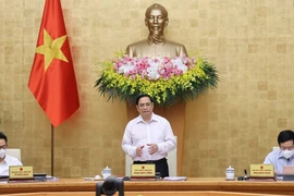 越南政府总理范明政主持政府6月例行会议