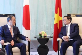 范明政总理会见日本前首相菅义伟