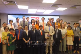 与会代表合影。图自越通社