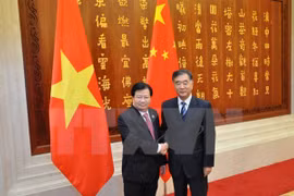 郑廷勇副总理会见中国国务院副总理汪洋（图片来源：越通社）