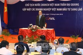 越南国家主席陈大光会见老挝越南投资商（图片来源：越通社）