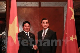 越南政府副总理兼外长范平明会见中国外交部长王毅