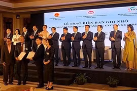 谅解备忘录签字仪式。图自越通社