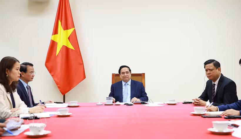 越南政府总理范明政与卡塔尔首相兼外交大臣通电话 。图片来源：越通社