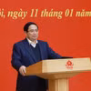 越共中央政治局委员、政府党委书记、政府总理范明政在会议上发表讲话。图自越通社