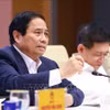 越南总理范明政在会议上发表讲话。图自越通社