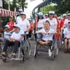 许多残疾人自强不息、融入社区，成为生活中的榜样，在社会各个领域得到认可和赞誉。图自越通社