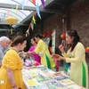 除了美食，还有民间音乐表演、奥黛秀、手工艺品展区，给在比越南侨胞和比利时友人带来一种温暖、愉快的感觉。图自越通社