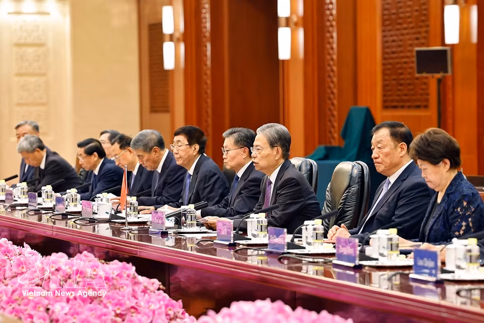 中国代表团成员。图自越通社