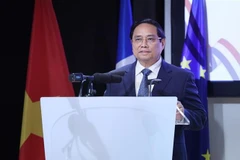 越南政府总理范明政出席越法企业论坛。图自越通社