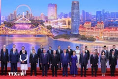 与会代表合影。图自越通社