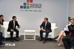 胡德福会见芬兰对外贸易与发展部长维莱·塔维奥。图自越通社