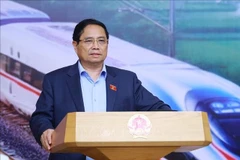 越南政府总理范明政发表讲话。图自越通社