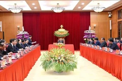 会见现场。图自越通社