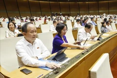 越南国会以409票赞成（占国会代表总数的85.56%）的结果通过了《〈人民检察院组织法〉若干条款修改和补充法》。图自越通社