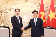 越共中央检查委员会主任阮维玉会见中国驻越南大使何炜。图自越通社