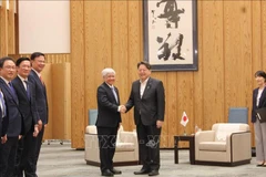 杜文战会见了日本内阁官房长官林芳正。图自越通社