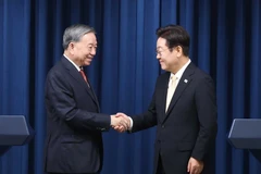 越共中央总书记苏林与韩国总统李在明。图自越通社