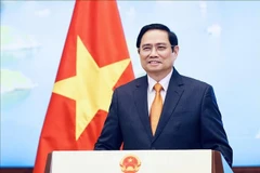 政府总理范明政。图自越通社