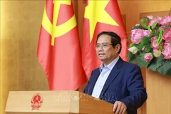 范明政总理发表讲话。图自越通社
