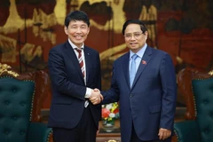 越南政府总理范明政会见日本群马县知事山本一太。图自越通社