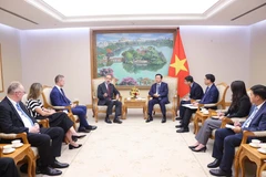 会见现场。图自越通社