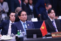 越南政府总理范明政出席东盟与中日韩领导人会议。图自越通社