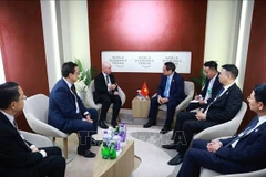 范明政总理会见美国Cisco集团亚太区总裁吴大维。图自越通社