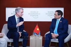 越南政府总理范明政会见德国西门子股份公司管理委员会成员、首席技术官和首席战略官彼得·科尔特。图自越通社