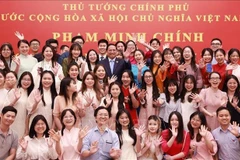 越南政府总理范明政会见旅居中国越南人社群代表。图自越通社