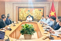 工作会谈场景。图自越通社