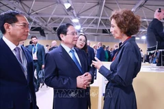 越南政府总理范明政和联合国教科文组织（UNESCO）总干事奥黛丽•阿祖莱。图自越通社